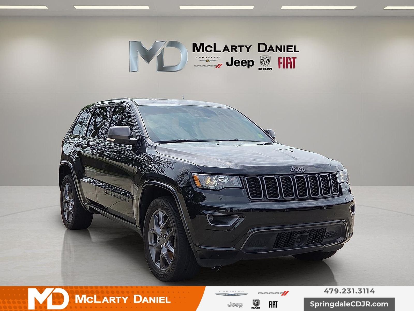 2021 Jeep Grand Cherokee 80th Anniversary 4x4 in Diamond Black — front three-quarter view
